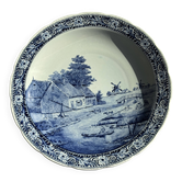 Vintage hollow circular plate in blue and white Boch pottery.