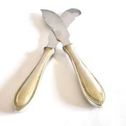 Two antique service knives in silver-plated metal, pearl frieze gowe alpacca.