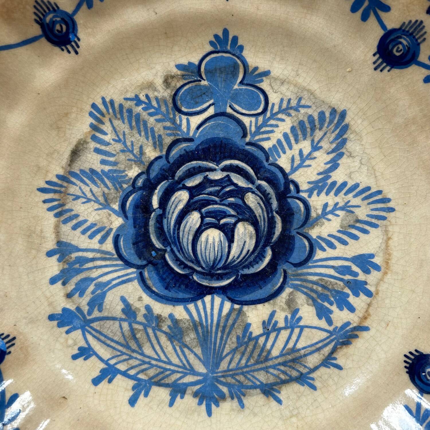 Old dish with blue floral decoration