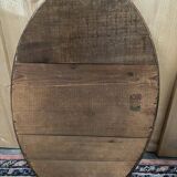 Oval mirror in gilded wood