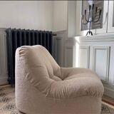 Vintage armchair reupholstered in boucle fabric.