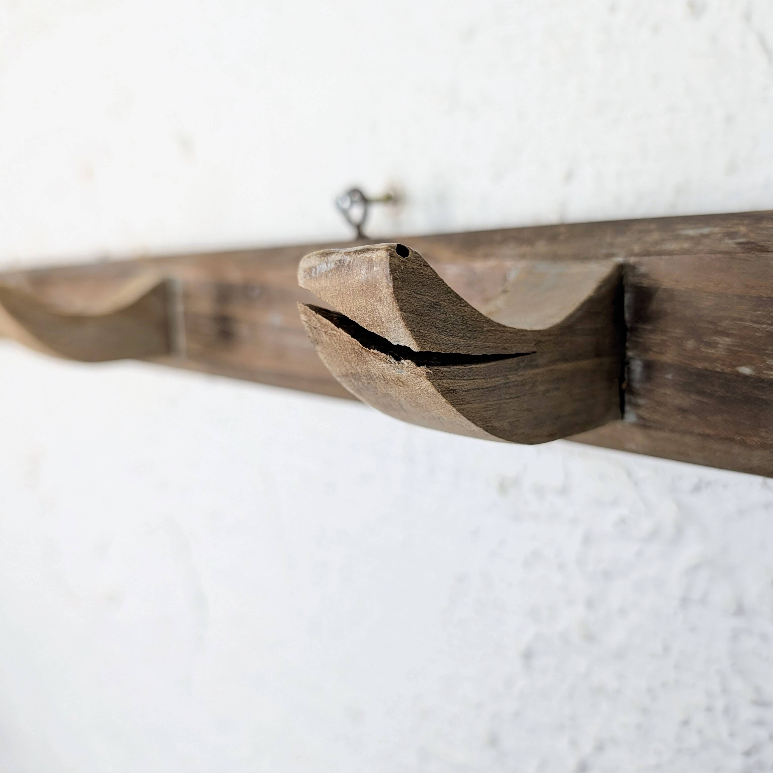 Handcrafted wall coat rack in raw wood