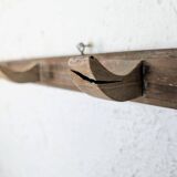 Handcrafted wall coat rack in raw wood