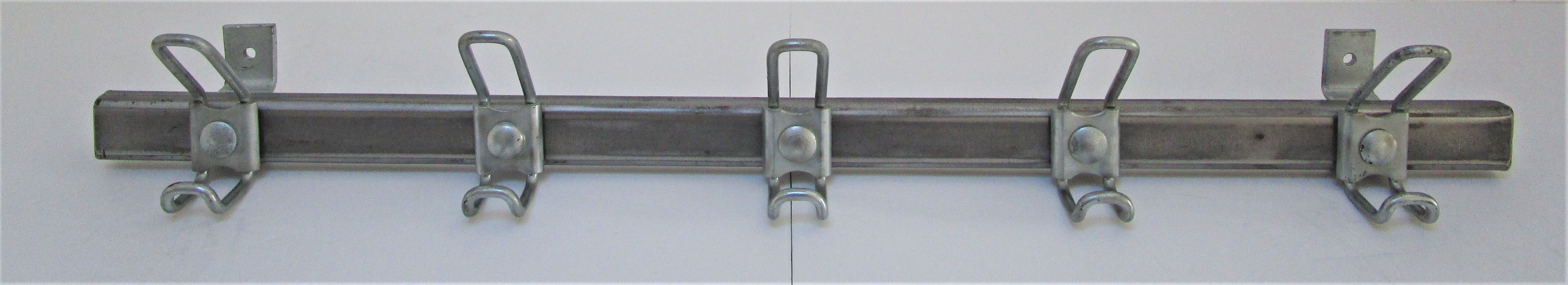 Vintage school wall rack in patinated steel