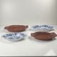 Set of 6 ceramic presentation plates in white and blue, floral pattern with woven wicker frame, 1970s/80s.