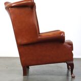 Elegant, smooth, and comfortable English Chesterfield wingback armchair in a beautiful classic color