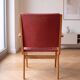 Vintage 1950s armchair in wood and red faux leather.