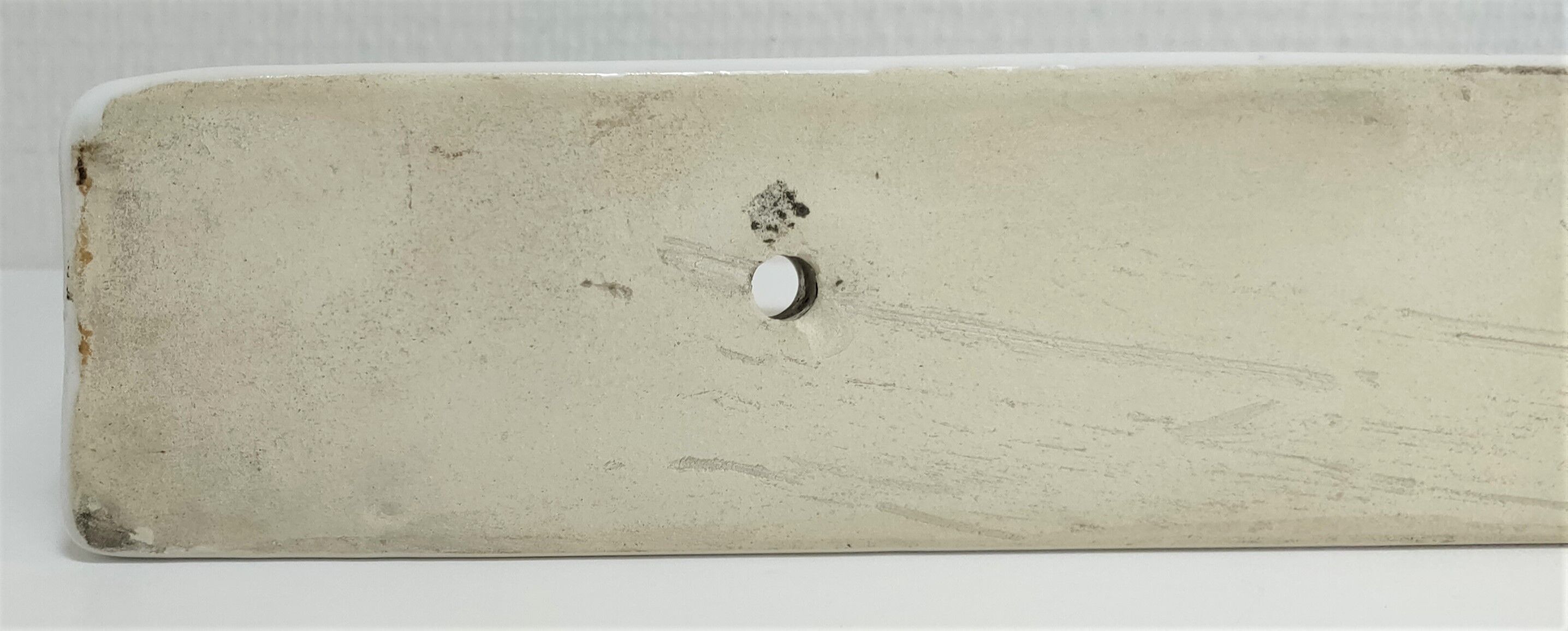 Vintage white glazed ceramic wall shelf