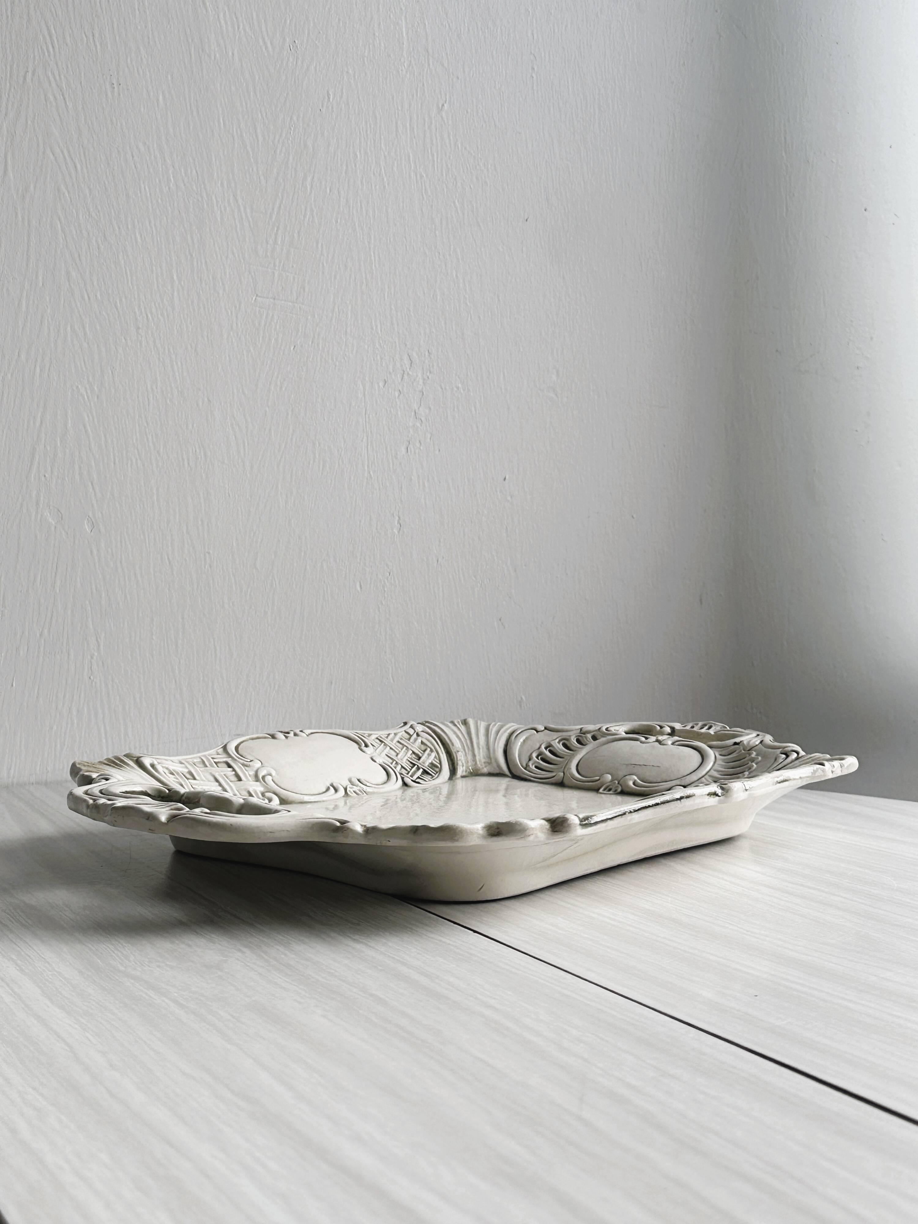 Old white ceramic tray, old dish.