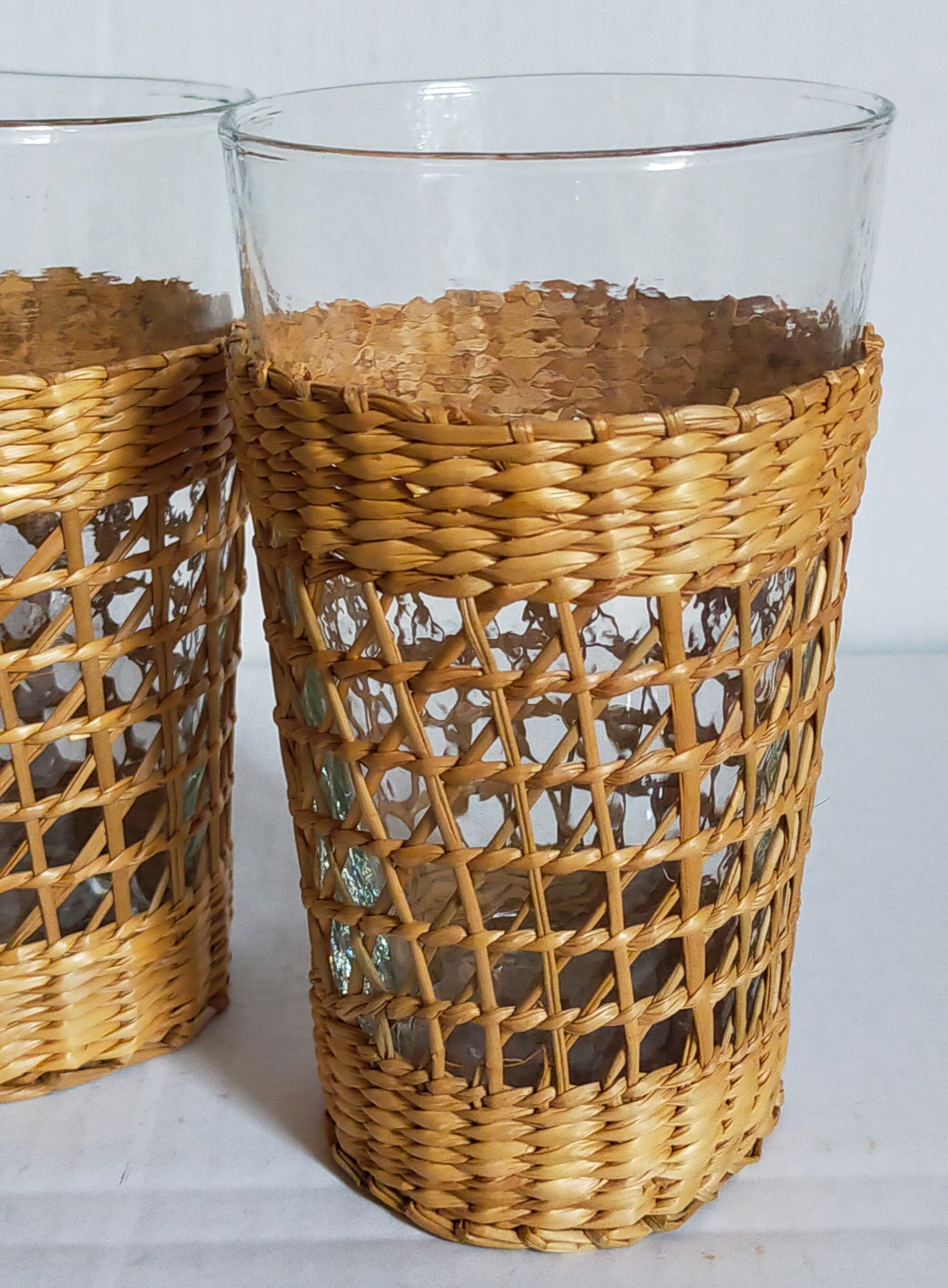 Four long drink glasses in vintage woven rattan cases
