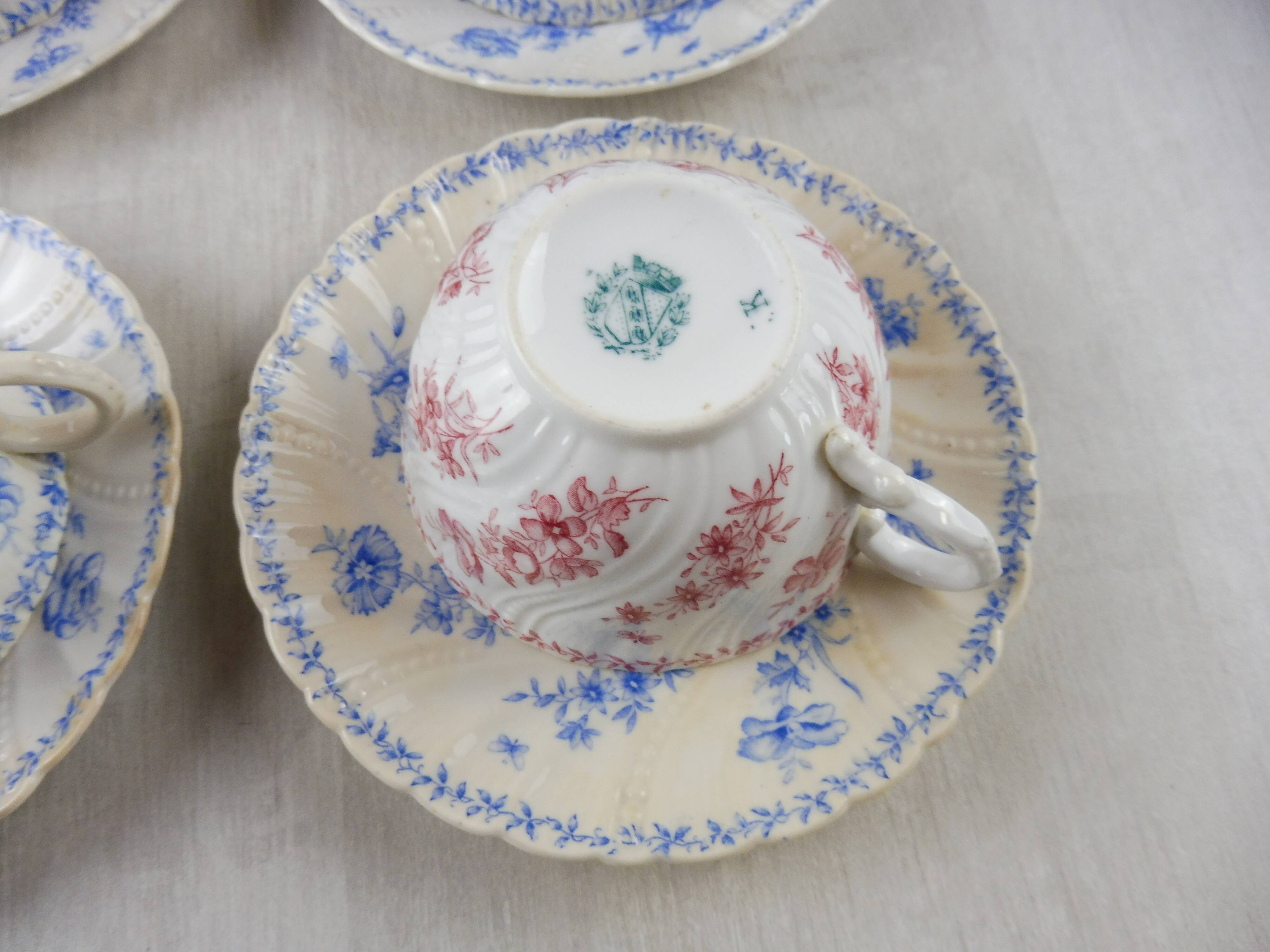 Lot of porcelain cups and under cups, twisted decoration, from Sarreguemines