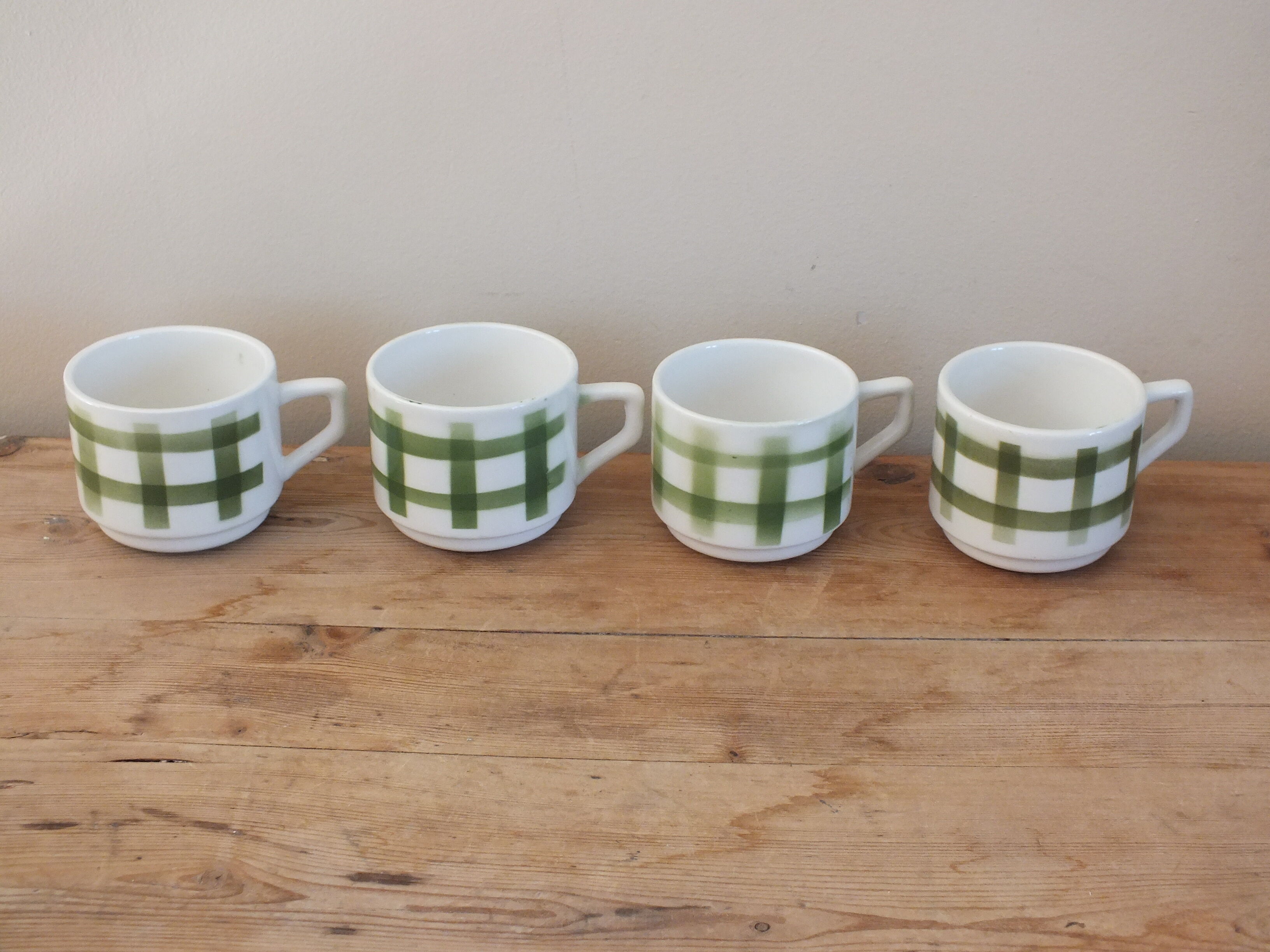 4 vintage cups with green tile decor