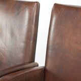 Set of 4 nicely finished dining chairs/side chairs with armrests made of cowhide leather