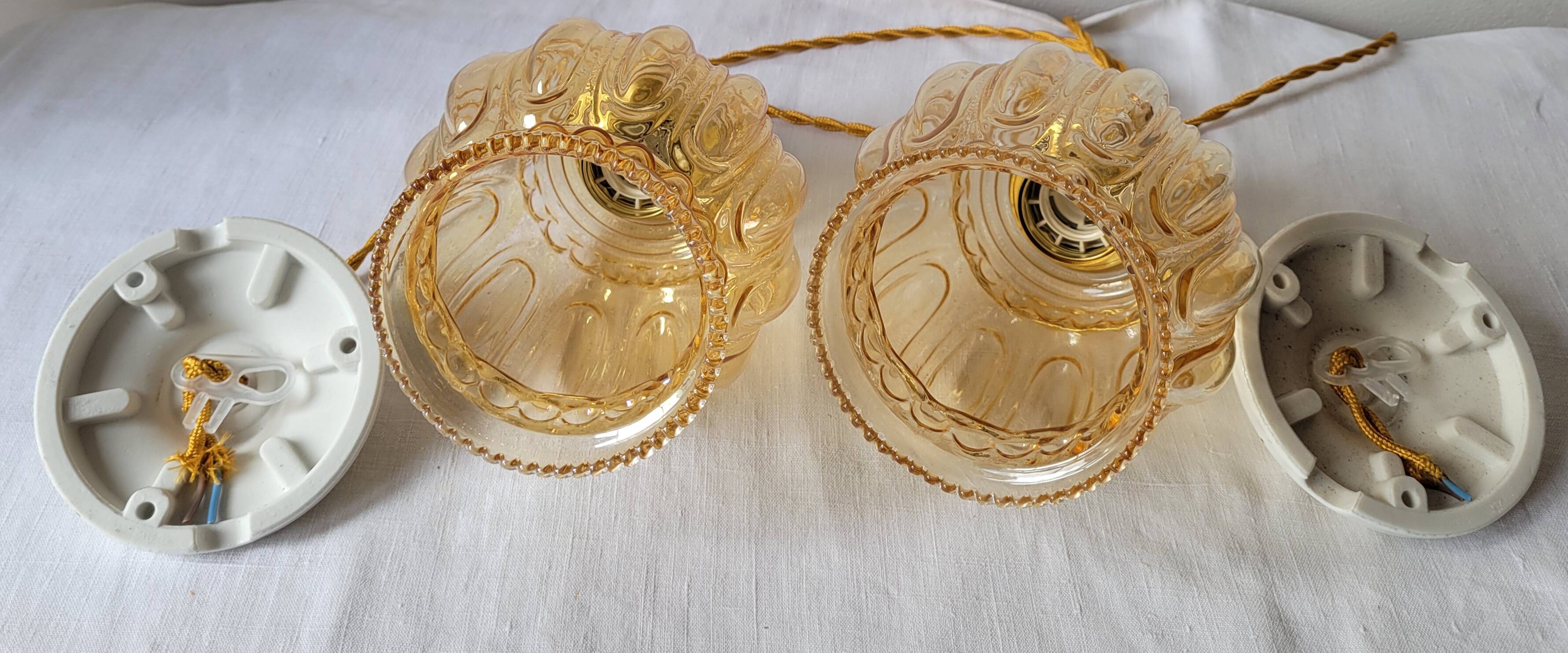 Duo of amber molded glass pendant lights