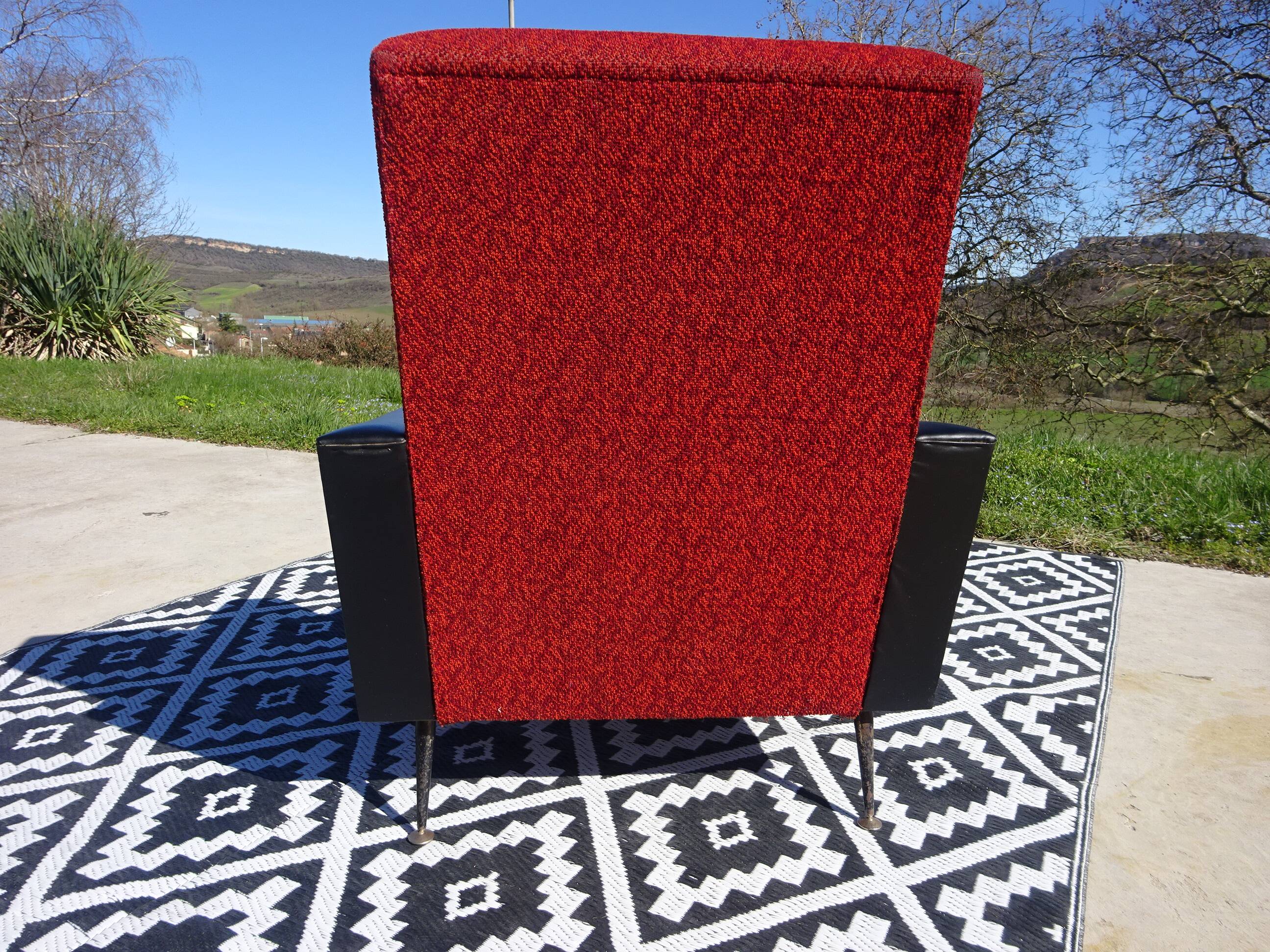Vintage armchairs in red and black faux leather, the pair.
