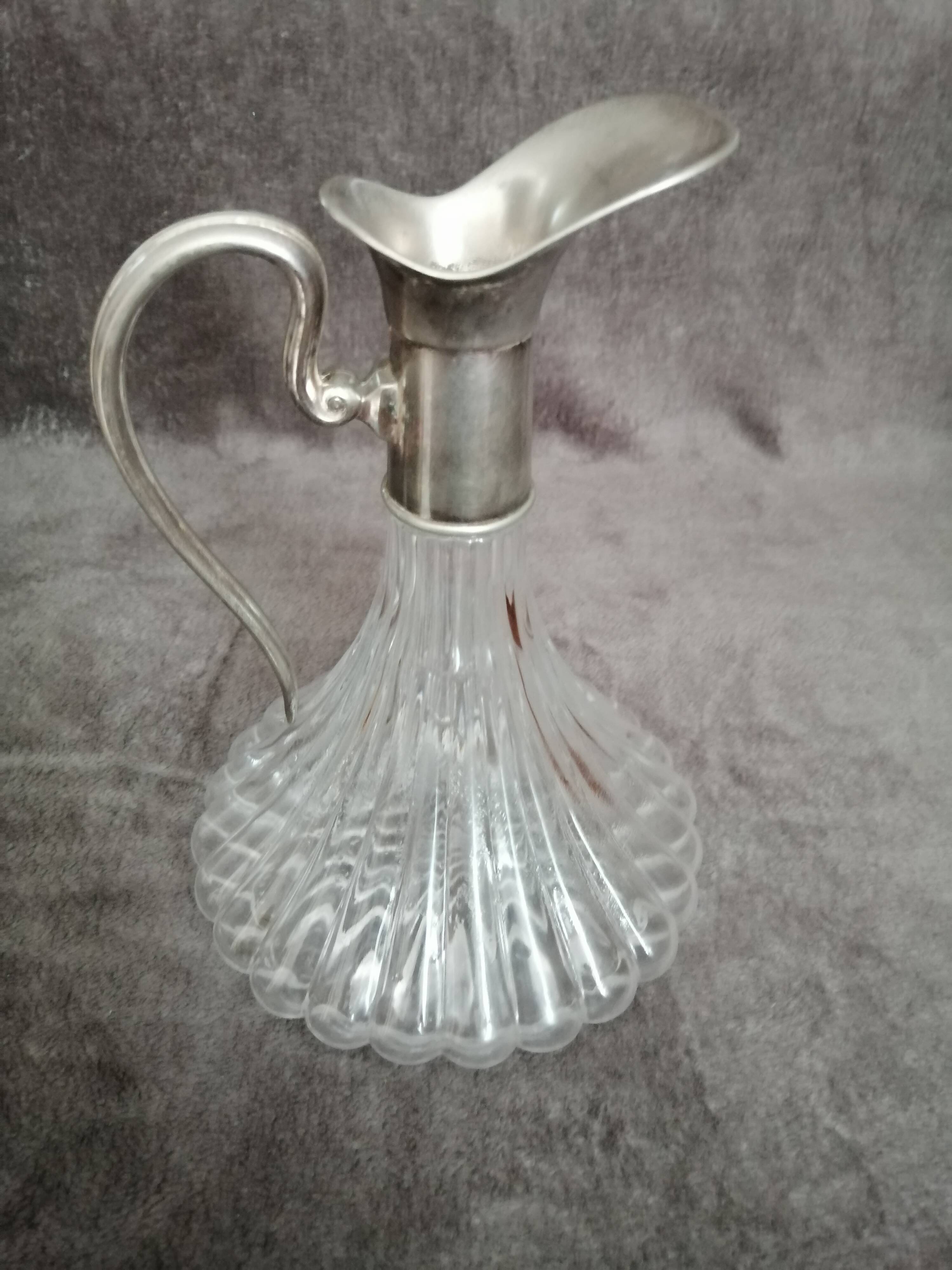 Glass and silver metal wine carafe