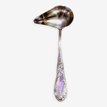 Spoon for serving sauce or broth with silver metal fat separator