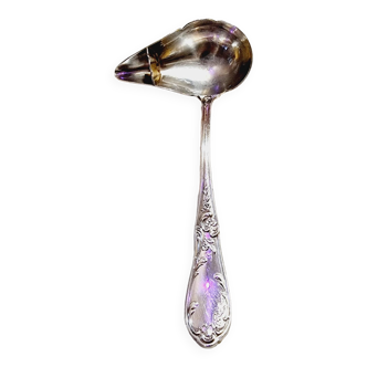 Spoon for serving sauce or broth with silver metal fat separator