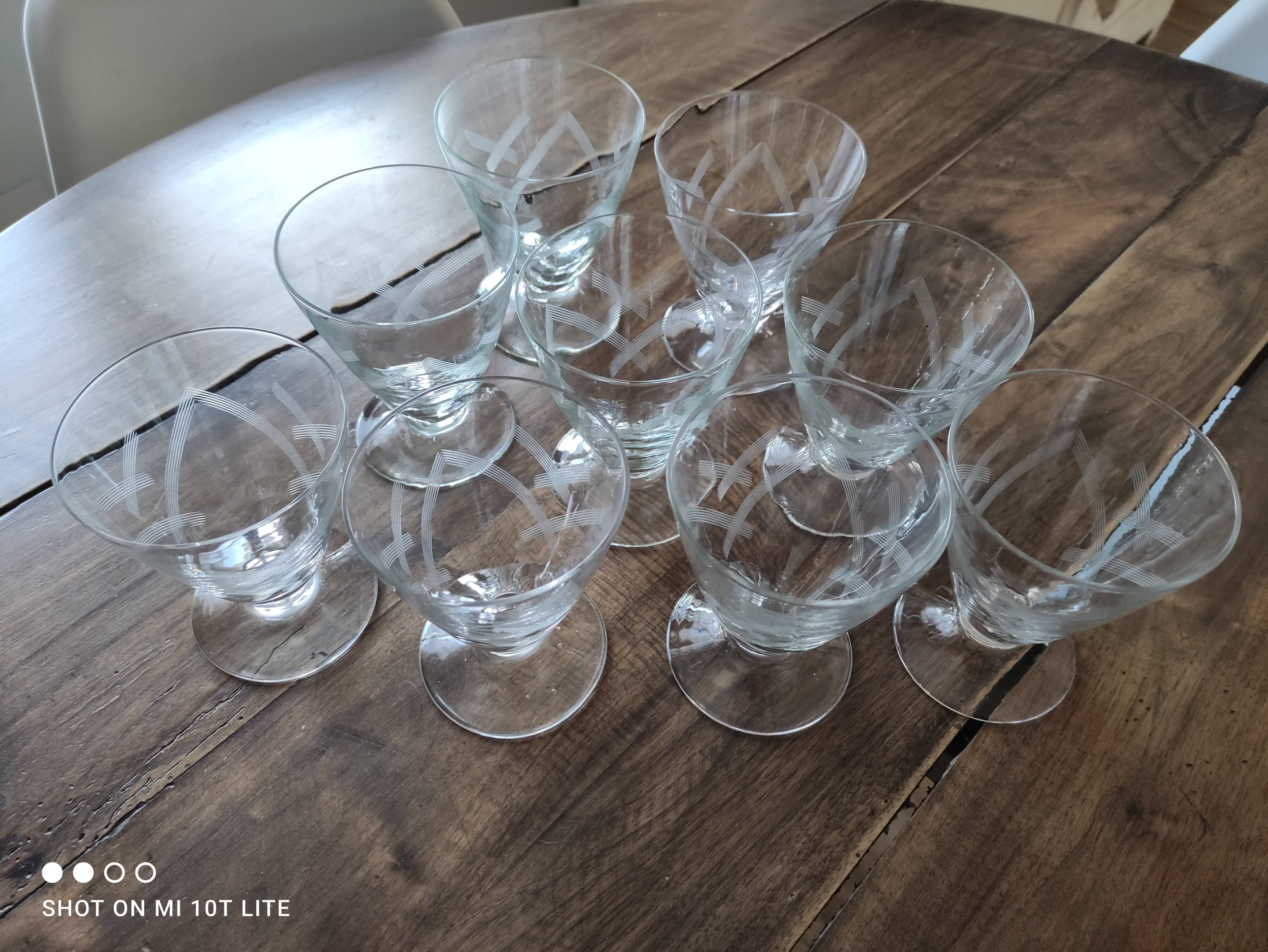 Set of 9 conical glasses on pedestal in antique chiseled glass crosses