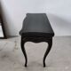 Molded blackened wooden play table, arched legs, green felt