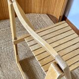 Folding chairs designed by Aldo Jacober in solid beech wood.