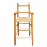Old wooden and straw high chair for children