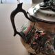 Teapot and sugar bowl in silver-plated metal.