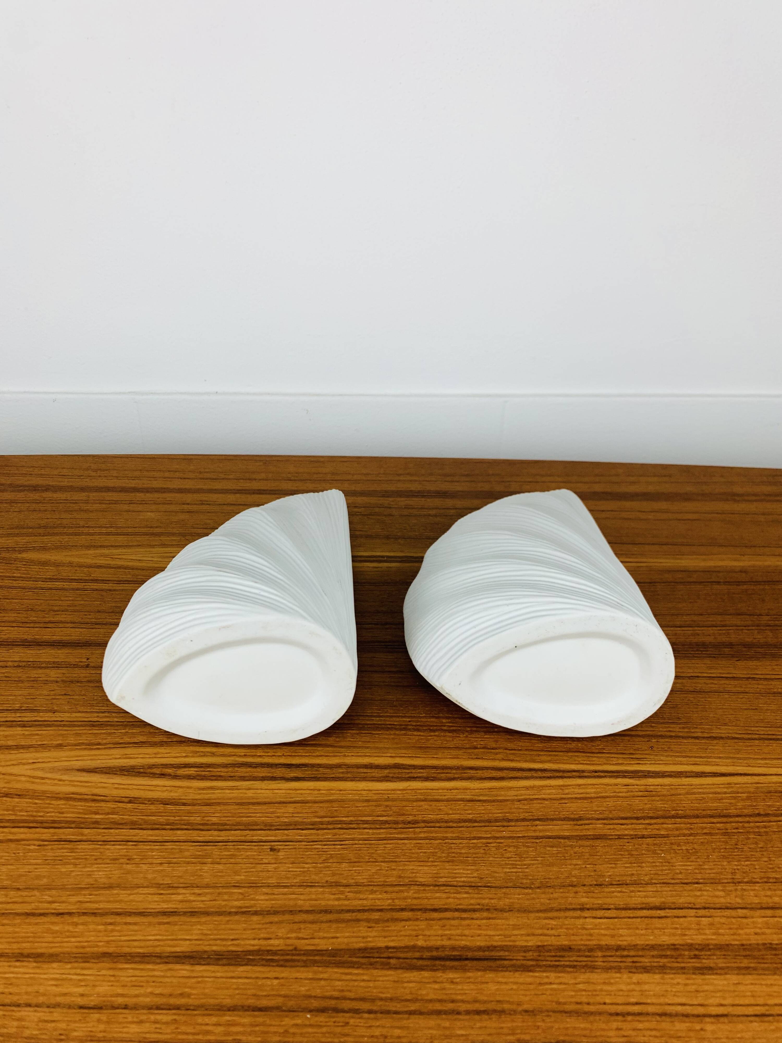 Pair of white ceramic coral vases, bookends