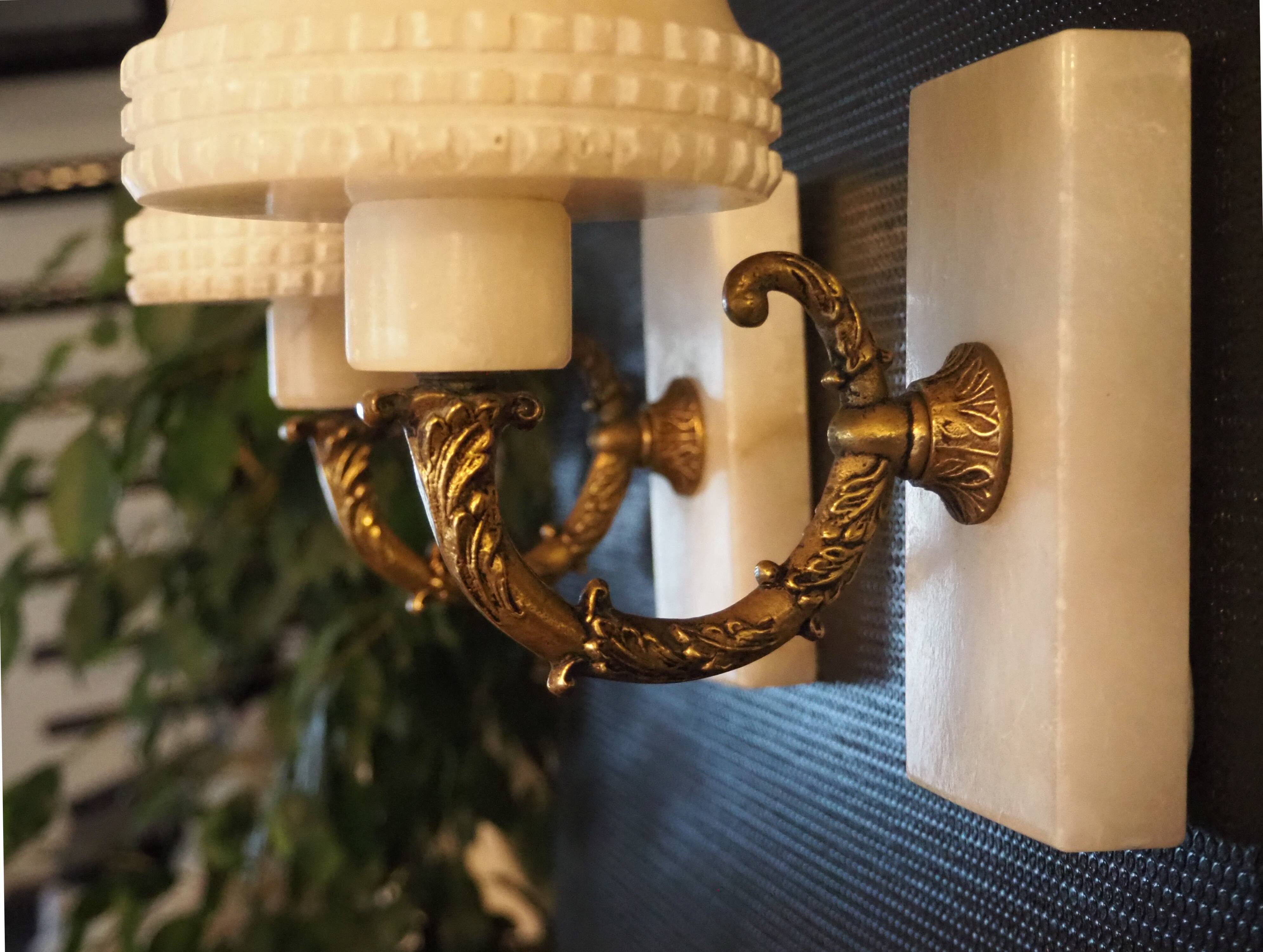 Pair of curved alabaster and bronze appliques