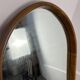 Miroir à tablette cerclage bois, forme ogive, années 60