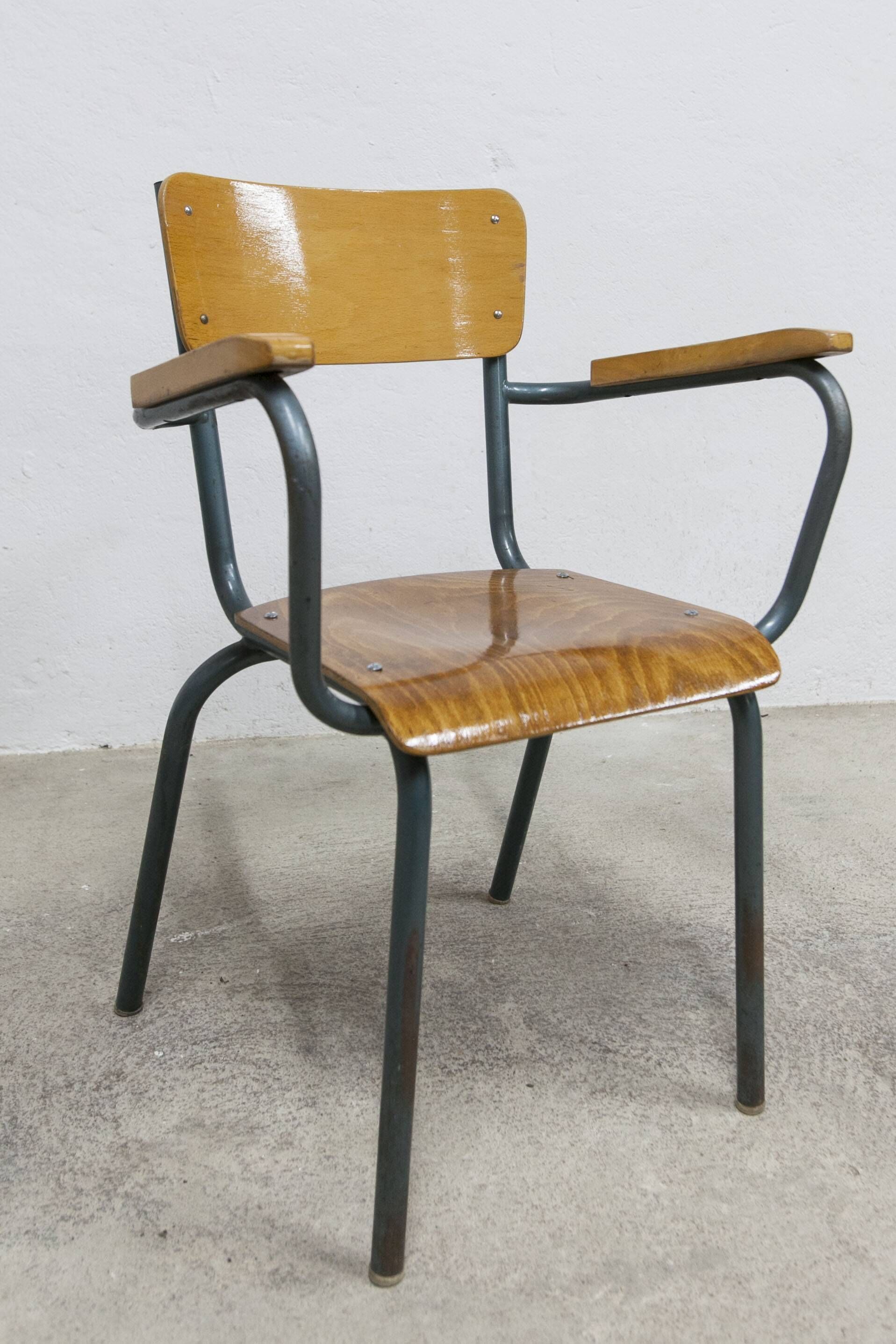 1962 school teacher's chair in honey color and tubular structure