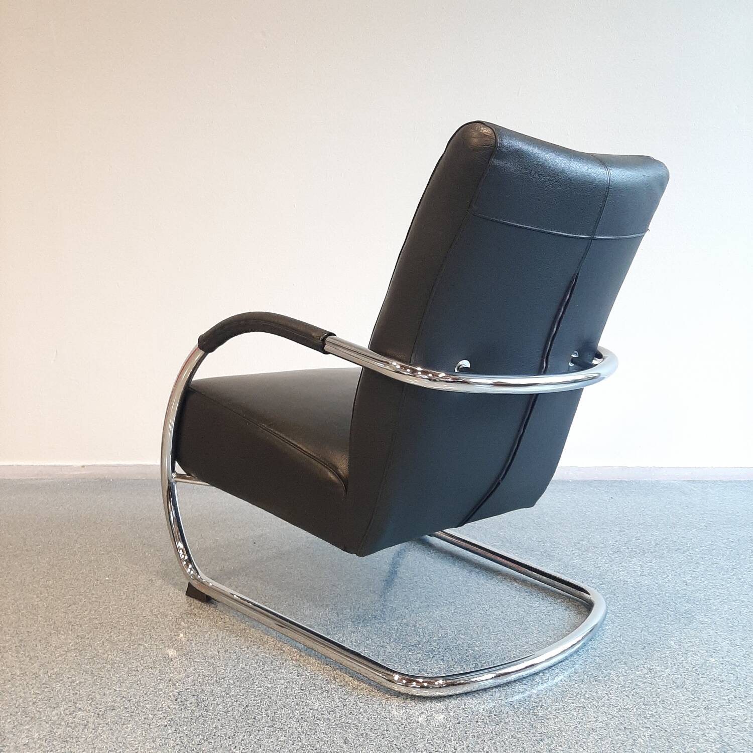 Pair of tubular armchairs