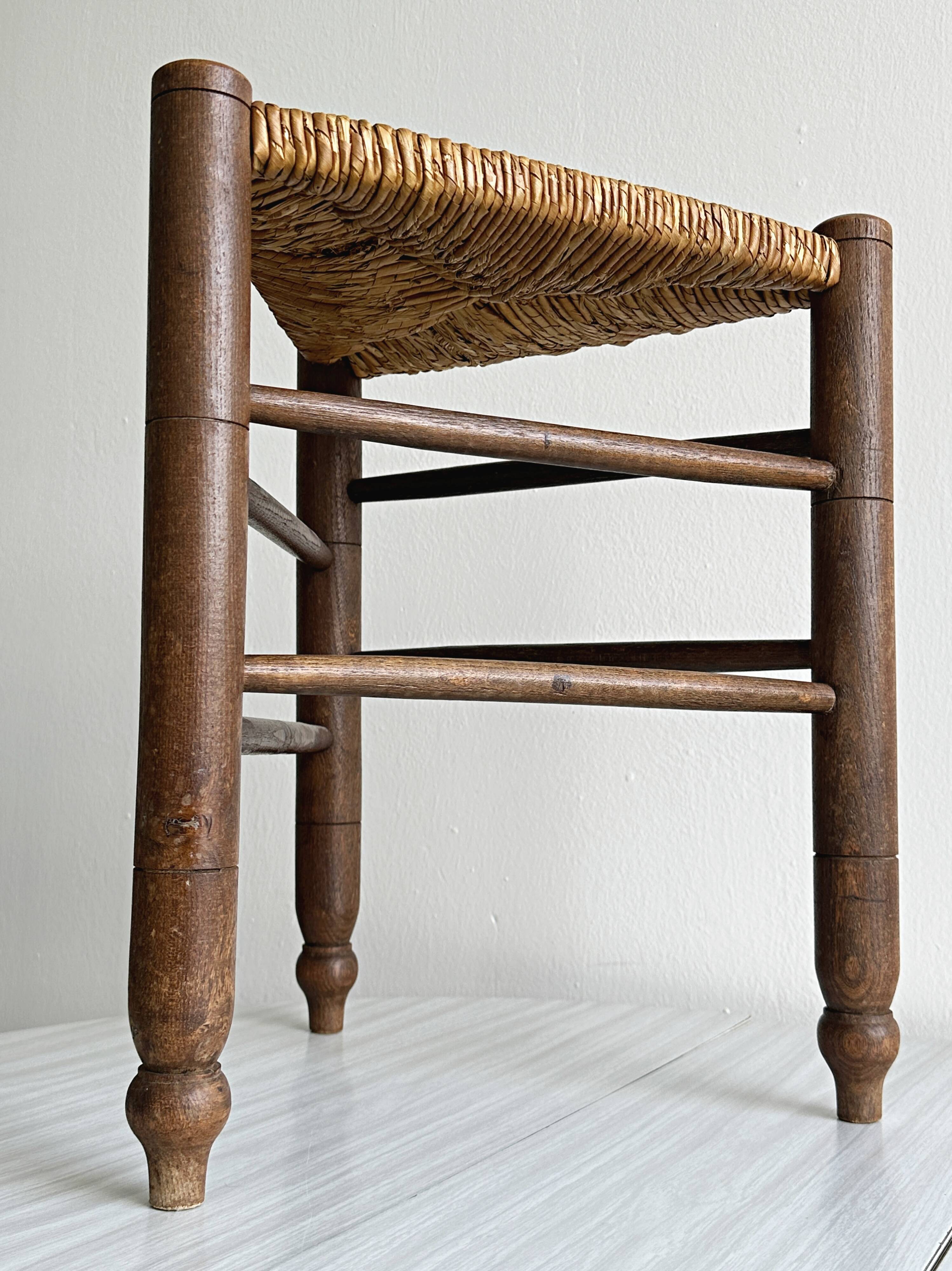 Triangular turned wooden stool