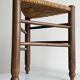 Triangular turned wooden stool