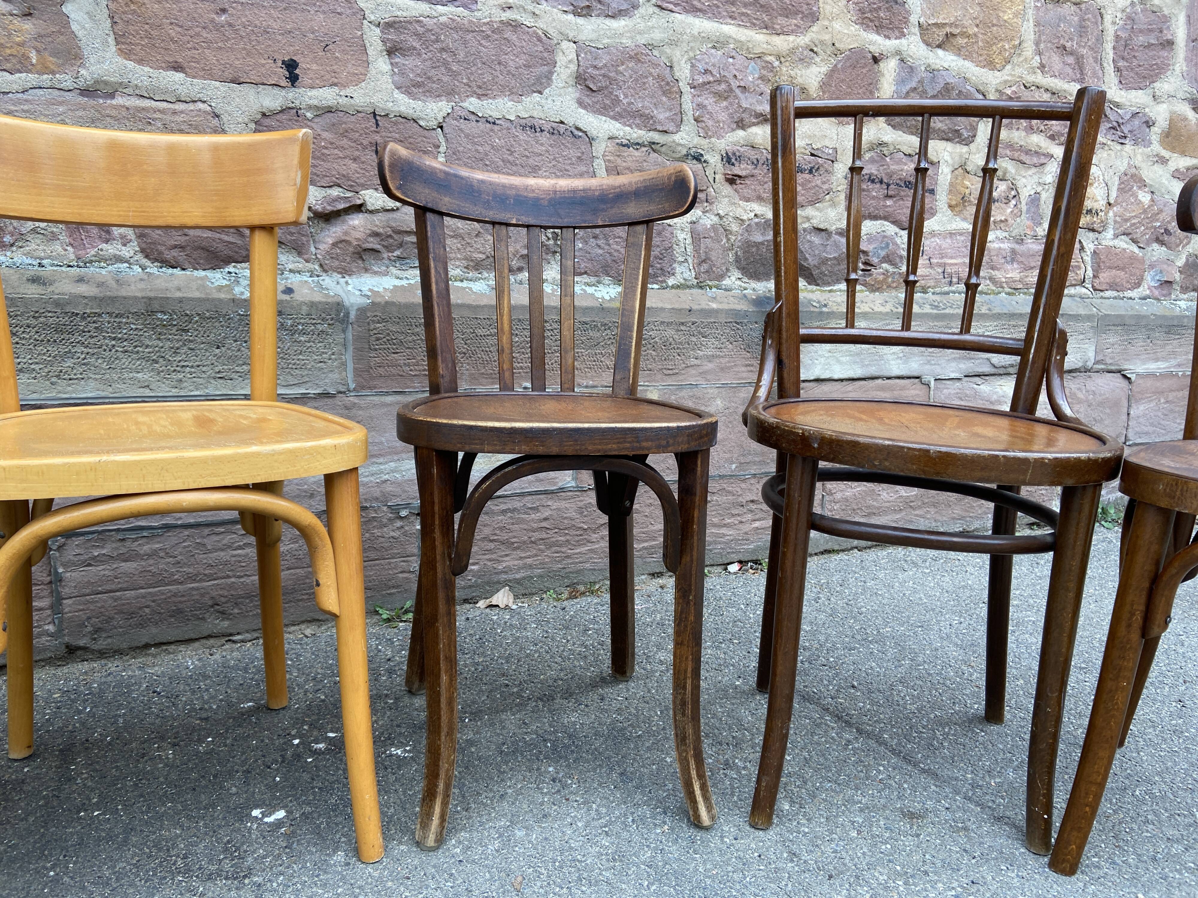 Lot 6 mismatched wooden bistro chairs
