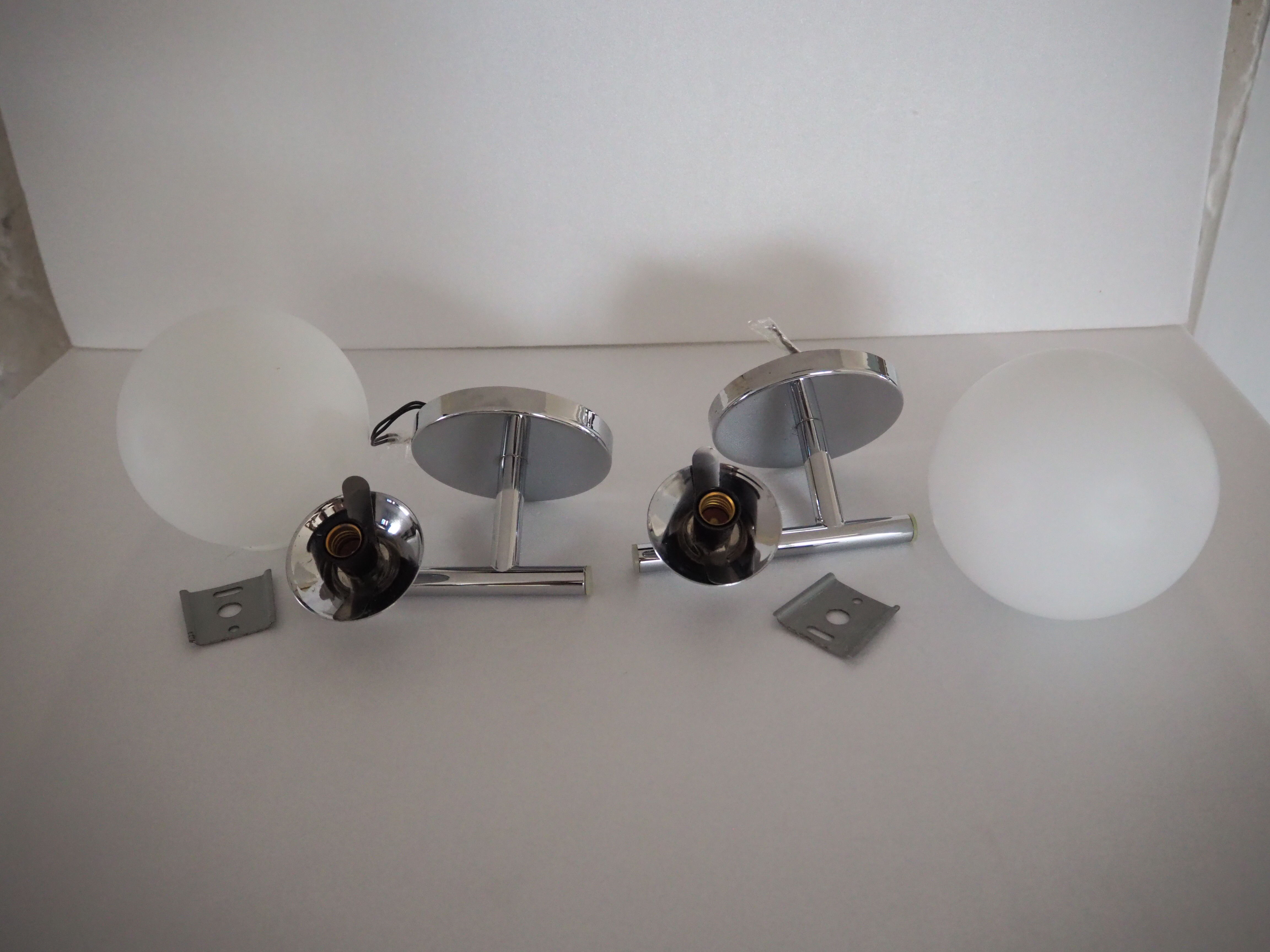 Pair of sconces with an opaline globe and chrome structure from the 1970s