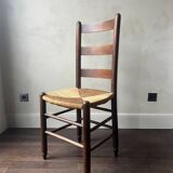 Set of 8 wooden chairs with rattan seats from the 1950s