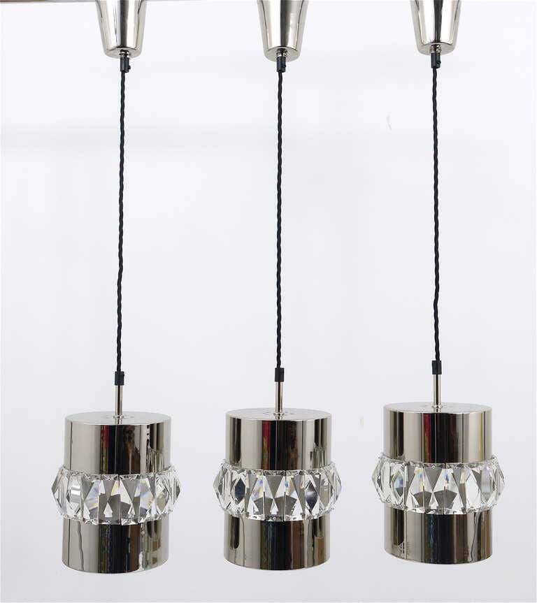 Three Bakalowits pendant lamps in nickel, brass, and faceted crystal, Austria, 1950s.