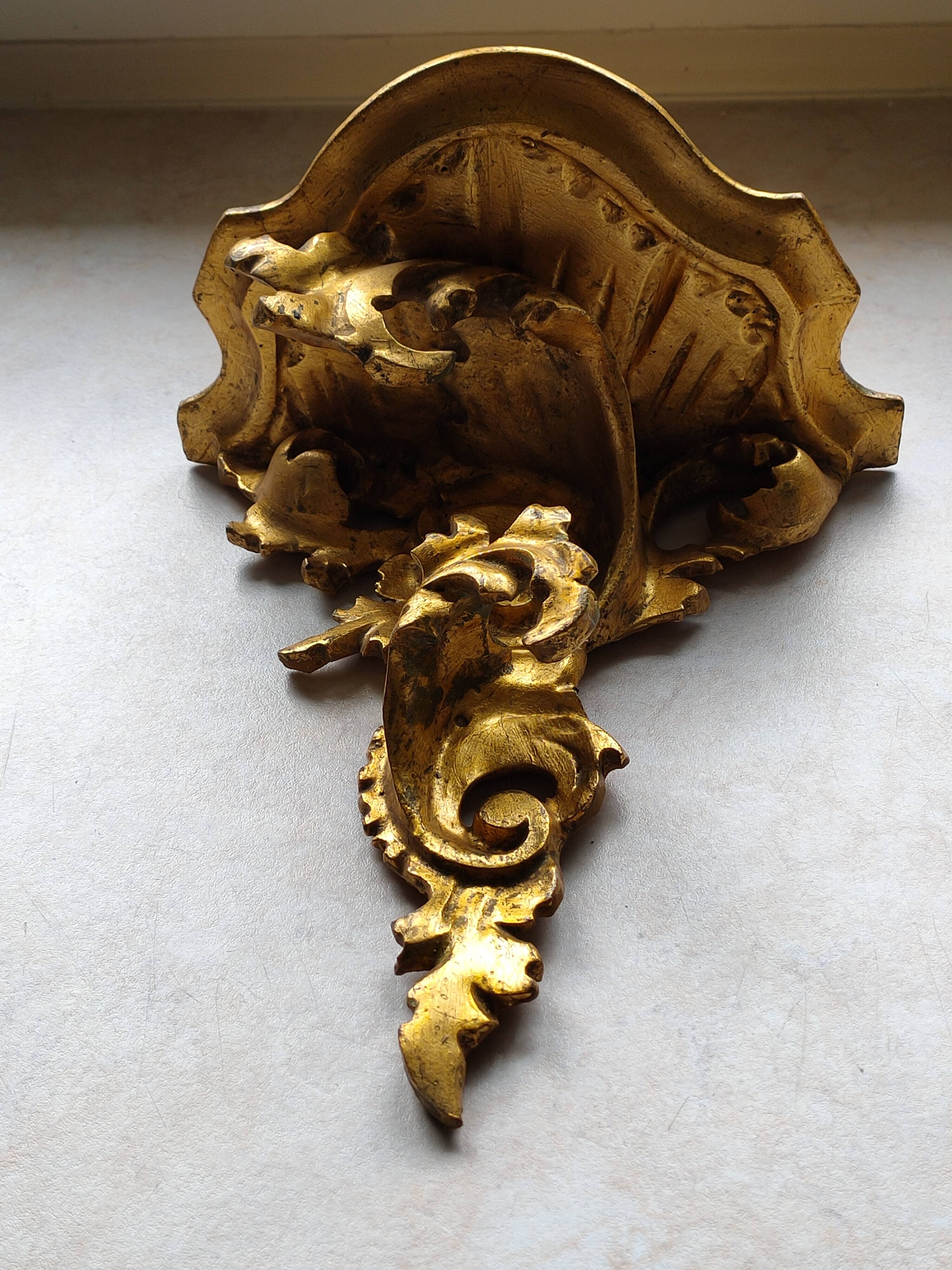 Baroque style golden shelf.