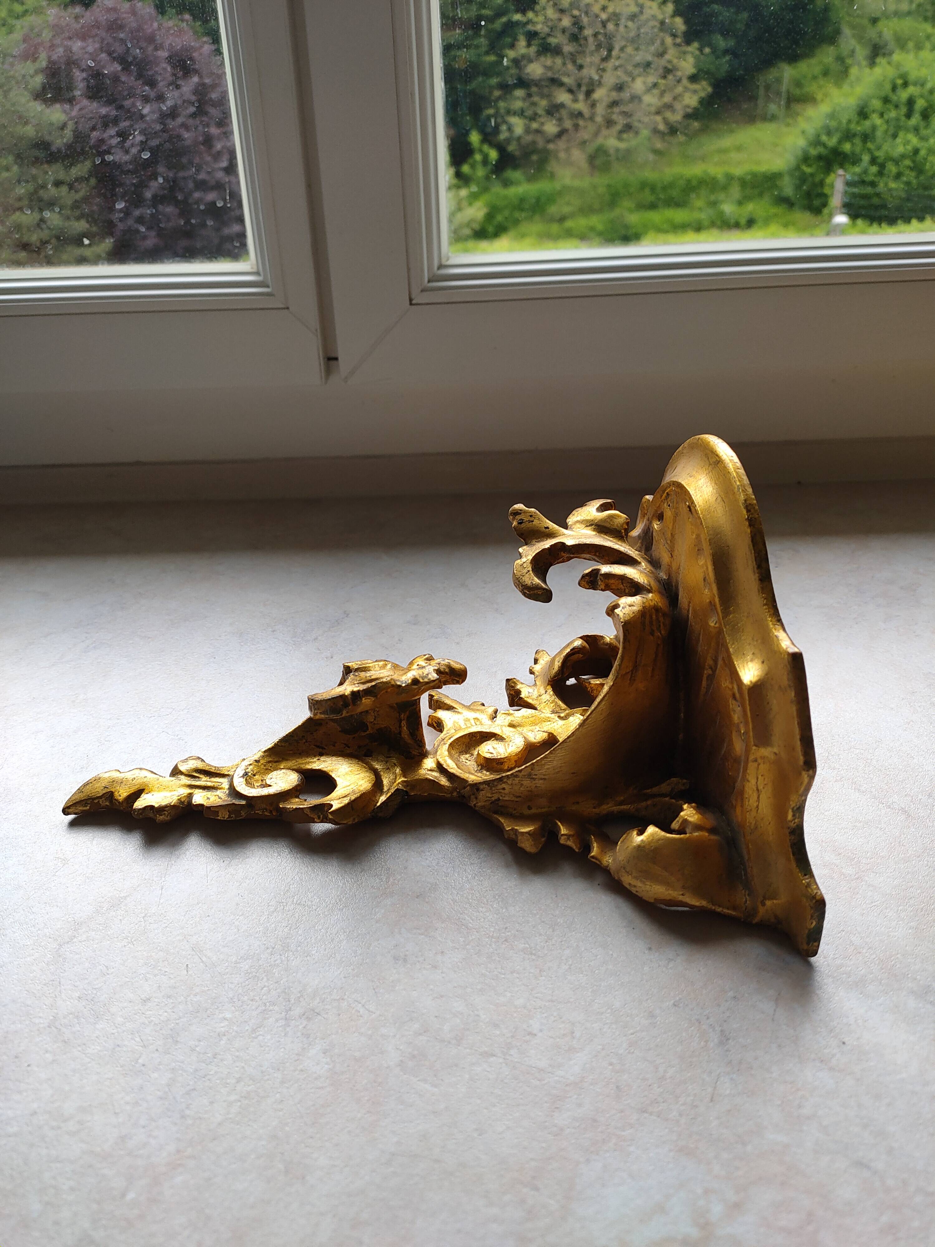 Baroque style golden shelf.