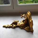 Baroque style golden shelf.