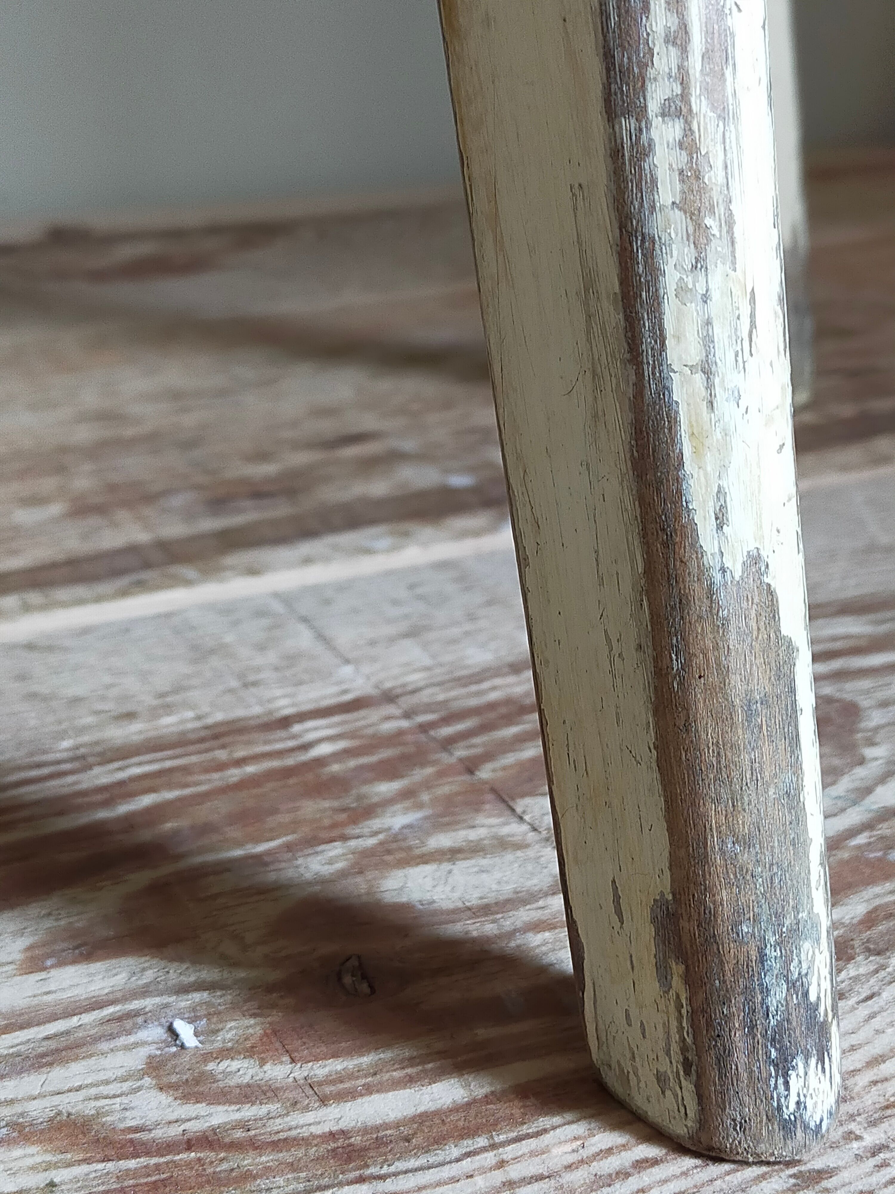 Old workshop stool in patinated solid wood