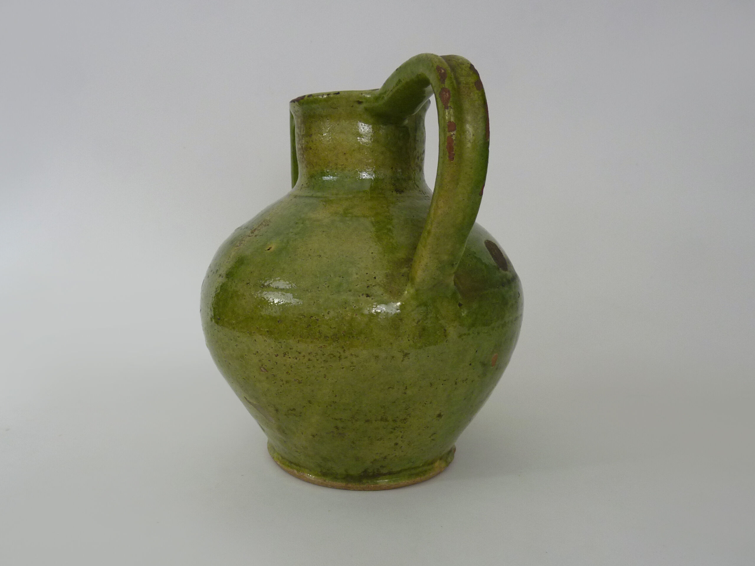 Pitcher pottery in green glazed terracotta, south west of France. XIXth