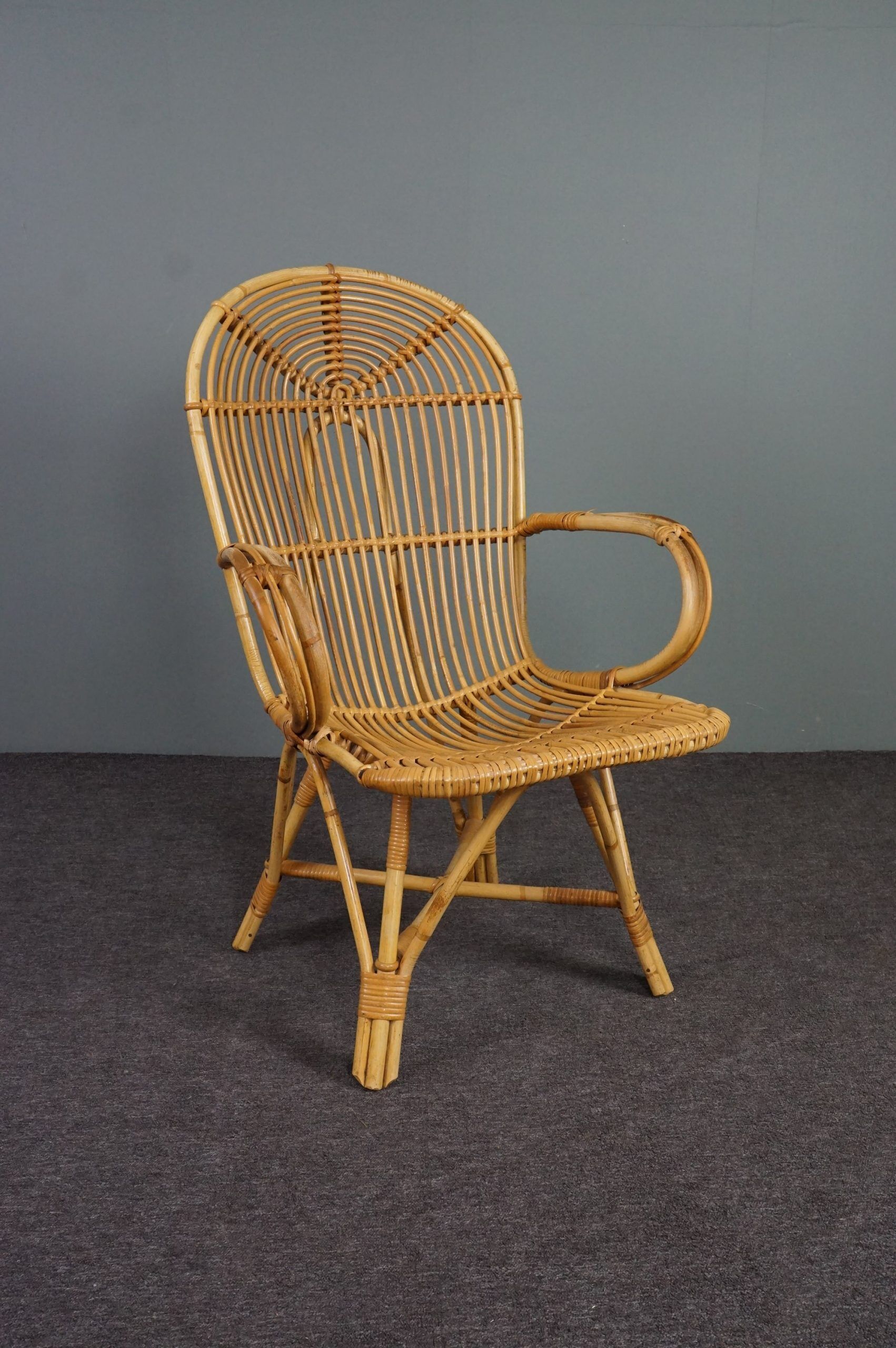 Rattan armchair with armrests by Rohé Noordwolde