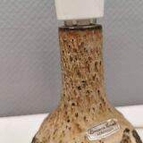 Small beautiful ceramic table lamp in earth colors.