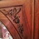 Old oval walnut wood mirror has flower carvings decoration