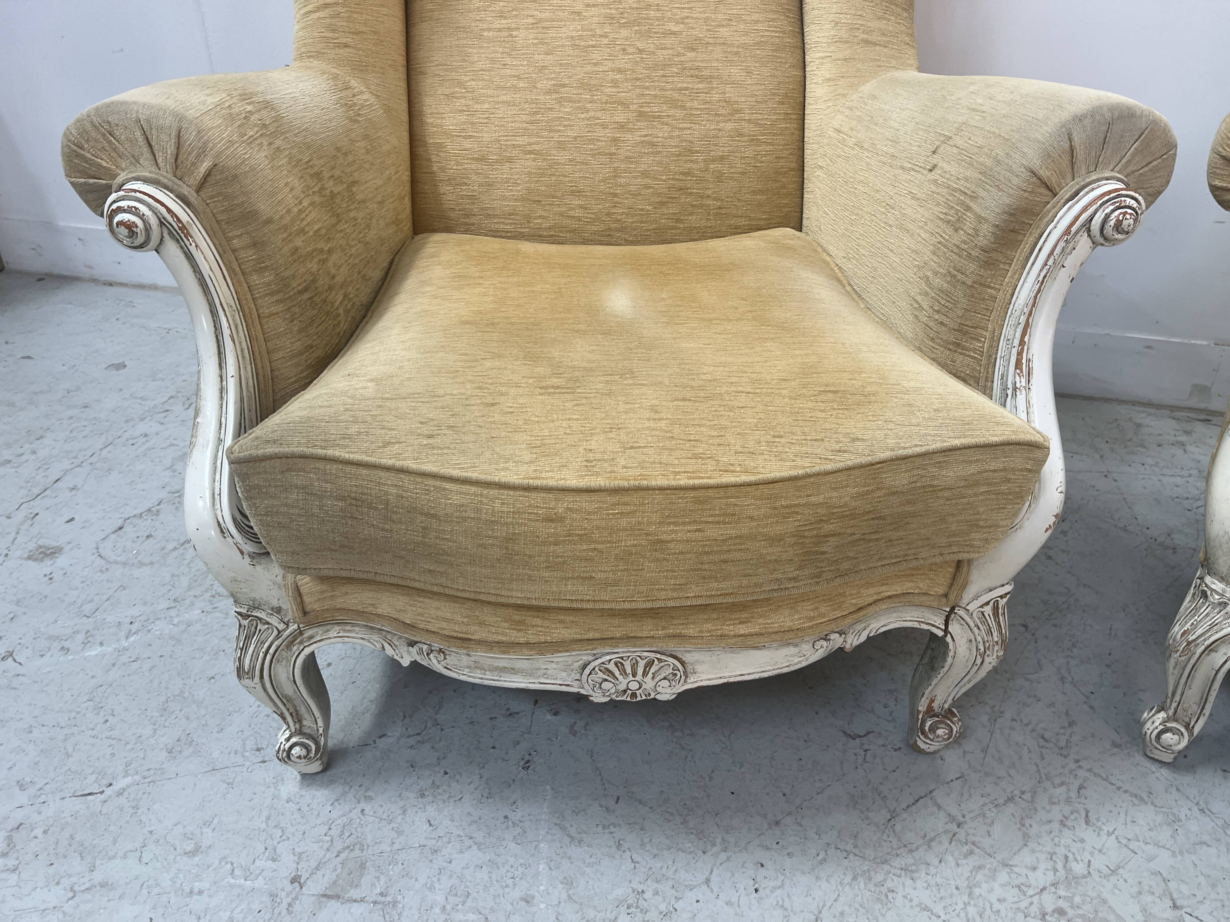 Pair of Louis XV style wing chairs in patinated beech, 20th century