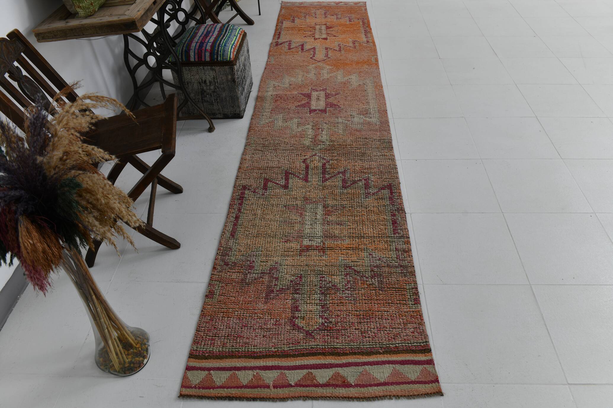 2x12 shades of pale orange vintage runner rug