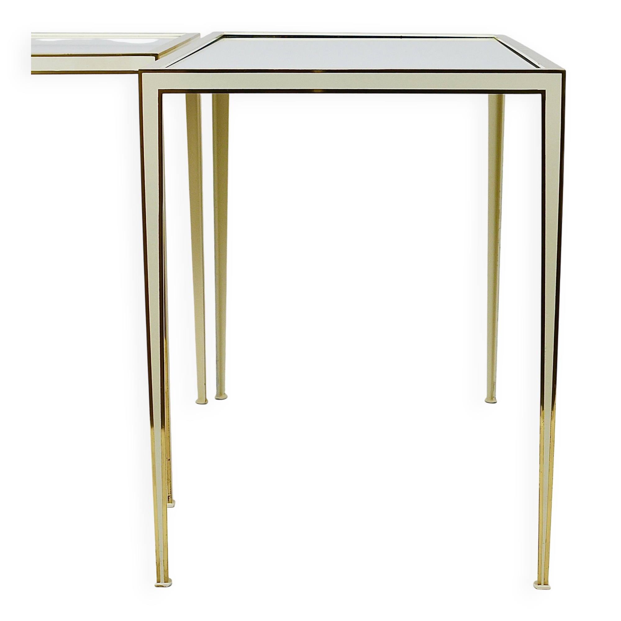 A pair of brass and white mirror tables from Vereinigte Werkstätten, Germany, 1970s.