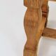 Vintage oak bench with striped linen fabric in a country style.